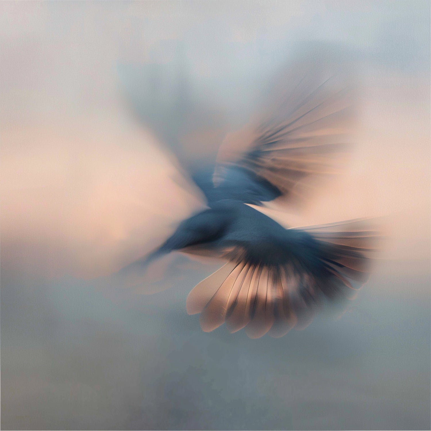 Blurred image of a humming bird in flight with a soft, pastel background